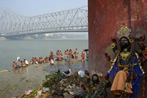 Typically Indian Prints: People bathing in the Hooghly River from a ghat near the Howrah Bridge