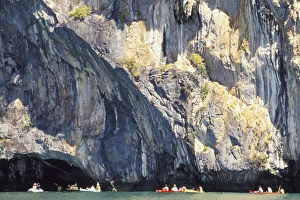 Phang Nga Prints: People canoeing near Tham Law (tube cove)