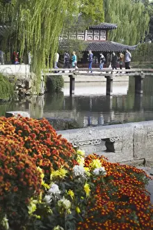 Gardens Prints: People crossing footbridge in Humble Administrators Garden, UNESCO World Heritage Site