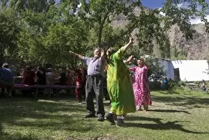 Images Dated 19th August 2009: People dance at a traditional Pamiri wedding, Bartang valley, Tajikistan