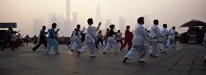 Health Prints: People doing early morning t ai chi exercises in the Huangpu Park on the Bund