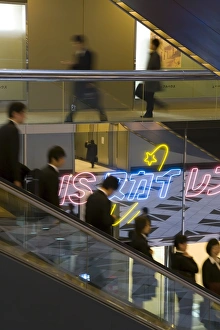 Shinjuku Prints: People on an elevator inside the Shinjuku NS Building
