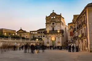 People enjoying passeggiata in Piazza Duomo on the tiny island of Ortygia, UNESCO