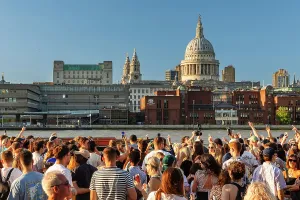 Enjoying Prints: People enjoying a summer evening at Bankside, London, England