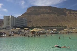 Dead Sea Prints: People floating in the sea and Hyatt hotel and desert