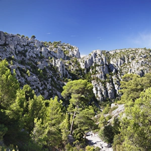Cassis Prints: People hiking through rocky landscape of les Calanques, National Park, Cassis, Provence