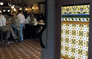 Tapa Prints: People inside a tapas bar and a detail of decorative tiled wall