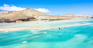 Kite Prints: People kiteboarding on waves crashing on white sand of Sotavento beach, Jandia