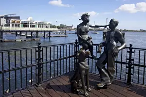 Bronze Prints: People Like Us, bronze sculpture of a young local couple with their dog