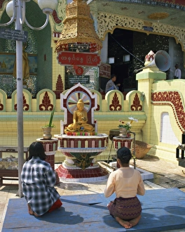 Burma Prints: Two people praying at a pagoda, Yangon (Rangoon), Myanmar (Burma), Asia