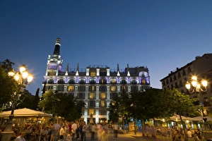 People relaxing in in the evening in Plaza de Santa Ana in Madrid, Spain, Europe