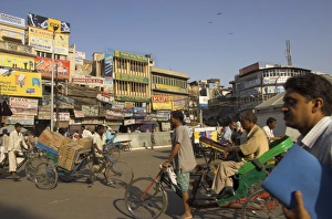 Rick Shaw Prints: People and rickshaws crossing the square
