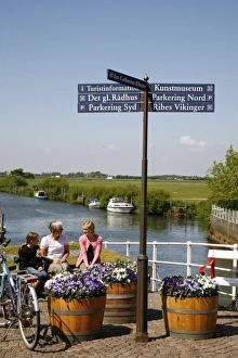 Signs Prints: People sitting on a bench at Ribe city center, Jutland, Denmark, Scandinavia, Europe
