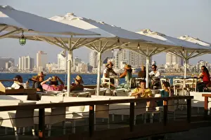 Bars Prints: People sitting at Casita Bar and Restaurant in Old Jaffa with a view over the sea and Tel Aviv