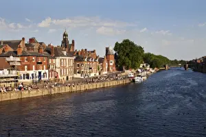 People sitting along Kings Staith by the River Ouse on a summer evening, City of York, Yorkshire, England, United Kingdom, Europe