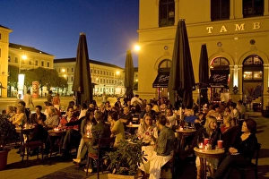 People sitting outside cafe Tambosi
