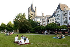 Alt Stadt Prints: People sitting in a park in the old town with St
