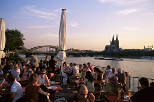River Rhine Prints: People sitting at the trendy Rheinterrassen bar
