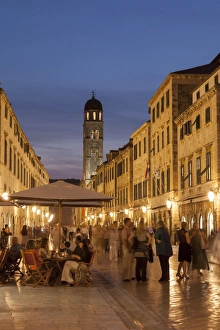 Night Life Prints: People strolling and cafes, Placa lit up at dusk, Dubrovnik, Croatia, Europe