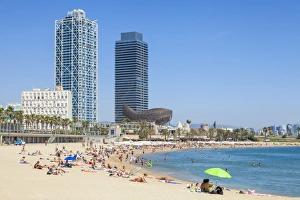 People sunbathing on Barcelona beach, Barceloneta, Barcelona, Catalonia (Catalunya)
