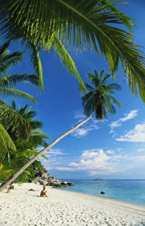 Terengganu Prints: Three People Sunbathing on the Beach of Terengganu, Perhentian Besar, Malaysia