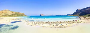 People sunbathing on idyllic white sand beach, Balos, Crete, Greek Islands, Greece