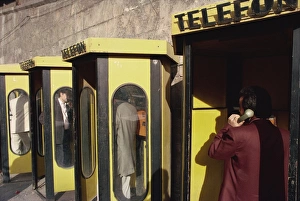 Kiosk Prints: People in telephone kiosks on Galata Bridge