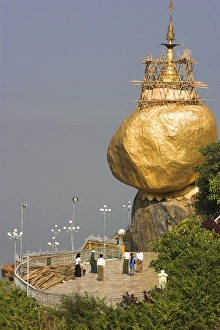 Images Dated 27th January 2000: People on terrace of Kyaikhtiyo Paya (Golden Rock Pagoda) balanced on the edge of a cliff at