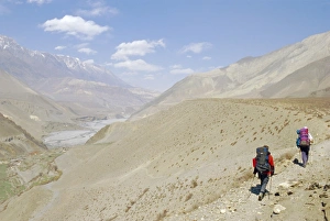 Unrecognisable People Prints: Two people trekking near KaGBeni