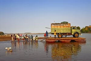 People and truck crossing the Manambolo River, Tsingy de Bemaraha, Madagascar, Africa