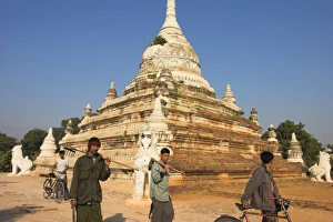 Sagaing Prints: People walk past temple, Sagaing Hill, Sagaing, near Mandalay, Myanmar (Burma), Asia