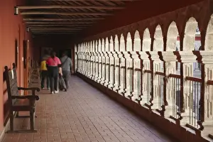 Bolivian Prints: People walking along corridor of San Francisco Museum inside San Francisco Church