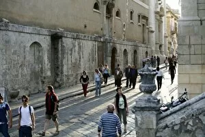 People walking by the main s treet in Noto, s icily, Italy, Europe