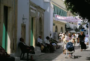 Tunisian Prints: People walking past Mosque of Mustapha