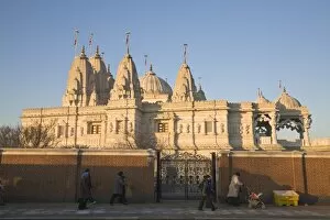 Administration Collection: People walking past Shri Swaminarayan Mandir Temple, the largest Hindu temple outside India