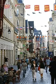 People walking along the Rue du Gros Horloge, the main street of old Rouen