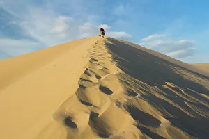 Footprint Prints: People walking up sand dune, Huacachina, Peru, South America