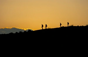 Walker Prints: People walking at sunset on top of White House Cliffs