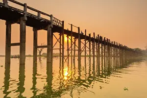 Adults Prints: People walking on U-Bein bridge over Taung Tha Man Lake at sunset