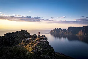 40 44 Years Prints: Person contemplating sunset from top of mountains, Senja island, Troms county, Norway