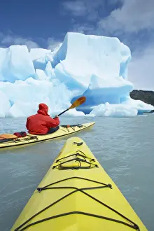 Person kayaking near icebergs, Lago Gray (Lake Gray) (Lake Grey), Torres del Paine National Park