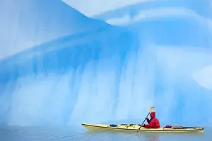 Person kayaking near icebergs, Lago Gray (Lake Gray) (Lake Grey), Torres del Paine National Park