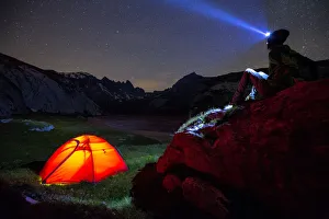 Starry Sky Prints: A person looks stars near his red tent. Unterer Segnesboden, Flims, District of Imboden