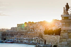 Photographing Prints: Person photographing the Grand Harbour in Valletta at dusk. Valletta, Malta, Mediterranean