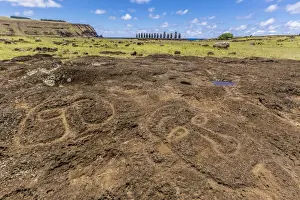 Restored Prints: Petroglyphs carved in the lava at the 15 moai restored ceremonial site of Ahu Tongariki on Easter Island