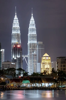 Floodlit Prints: Petronas Towers dominate the Kuala Lumpur skyline