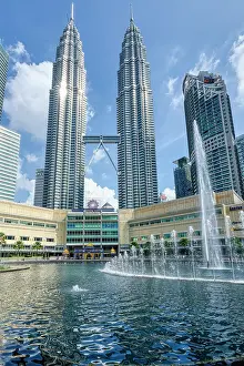 Tall Prints: Petronas twin towers and Symphony Lake in KLCC park, Kuala Lumpur, Malaysia, Asia