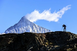 Photographer Prints: Photographer in action in front of the snowy Weisshorn, Zermatt, Valais, Pennine Alps