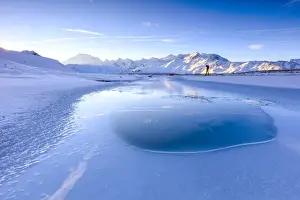 Photographer Prints: Photographer admires Lake, Piz Umbrail at dawn with Mount Ortles in background