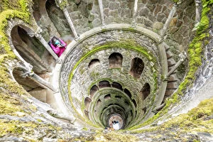Holiday Maker Gallery: Photographer at the top of the spiral stairs inside the towers of Initiation Well